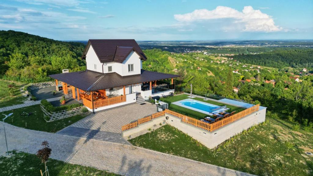 an aerial view of a house with a swimming pool at Villa AD Astra by Villas Guide in Sesvete