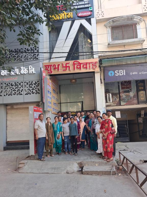 a group of people standing in front of a store at HOTEL RAJBHOG indore in Indore