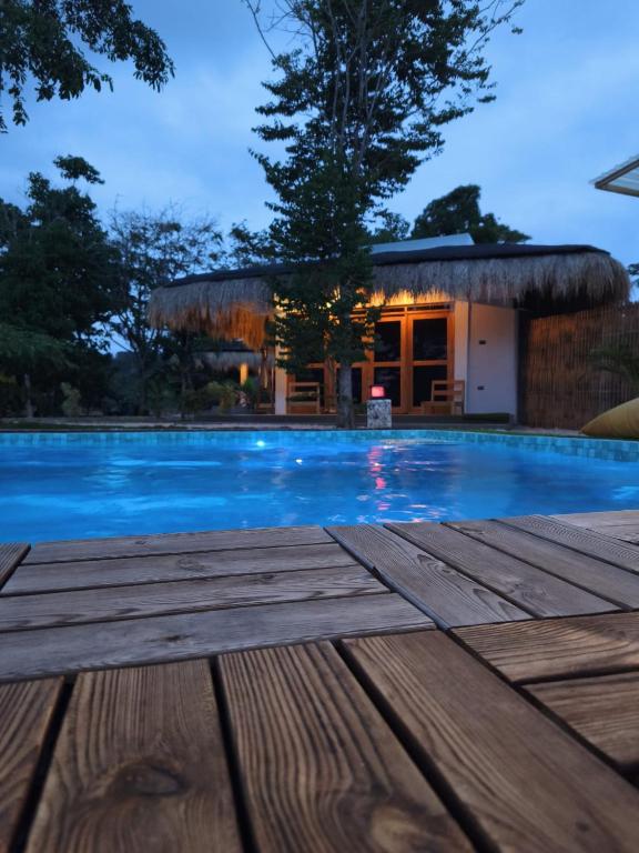 a swimming pool in front of a house at Casa Ysatis in San Juan