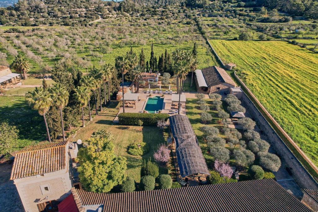 an aerial view of a mansion with trees and a train at S'Hort de Son Caulelles - Adults Only in Marratxí 