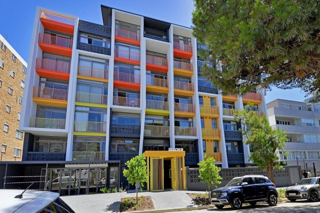 an image of an apartment building with colorful balconies at SIX ON N - Fluent Serviced Apartments in Cape Town