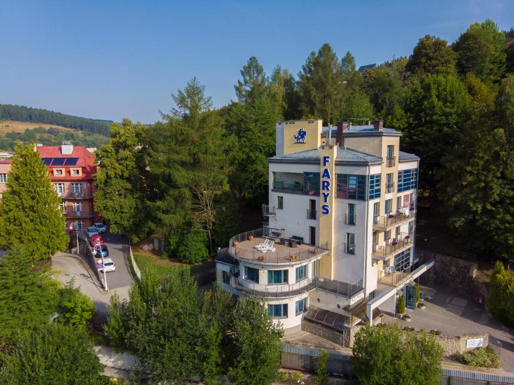 a building with a sign on the side of it at Farys - świetna lokalizacja, sauna, jacuzzi, piękne widoki z okien in Krynica Zdrój