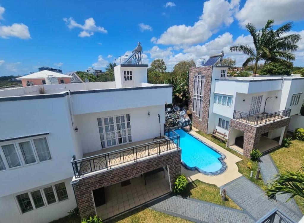 an aerial view of a house with a swimming pool at Sea Bliss Villa1 in Pereybere