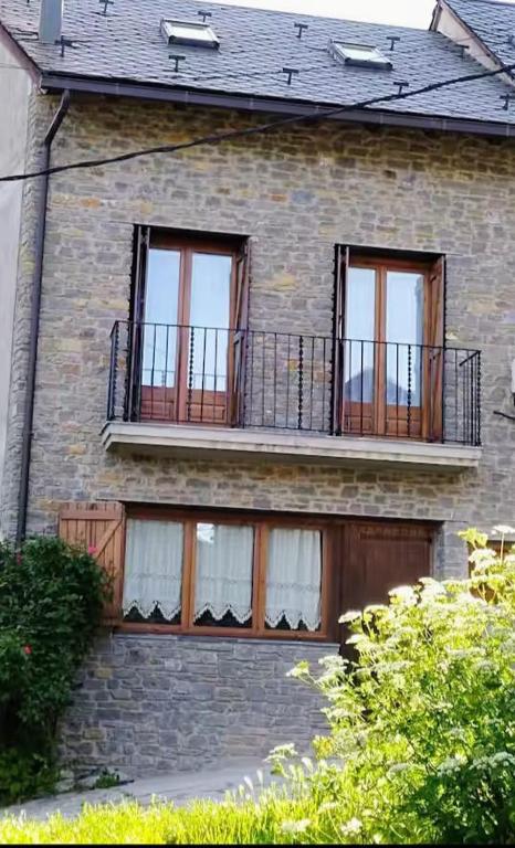 a brick house with a balcony and windows at CR TESOL 6 SON - ALT ANEU in Son
