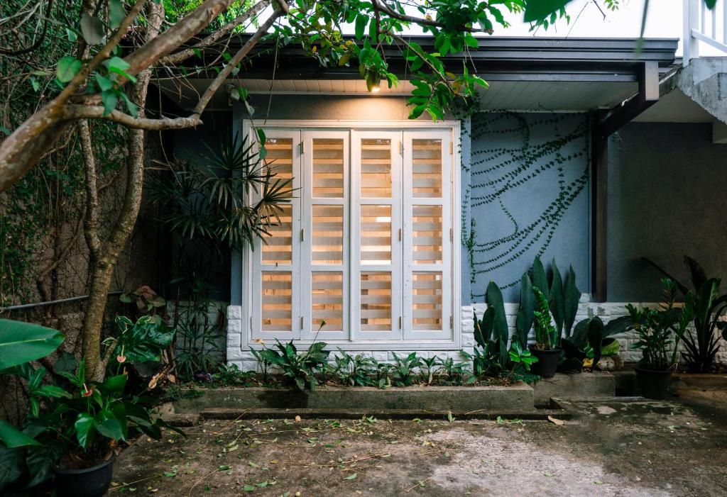 a house with a window and some plants at Heaven R in Kandy