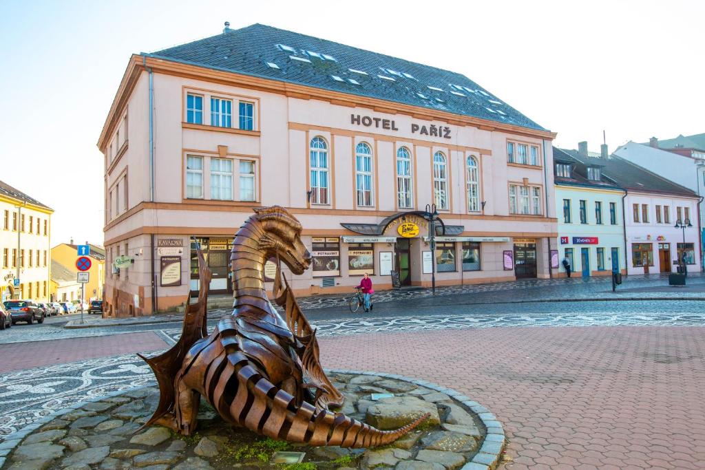 a statue of a horse in front of a building at Hotel Paříž in Jičín