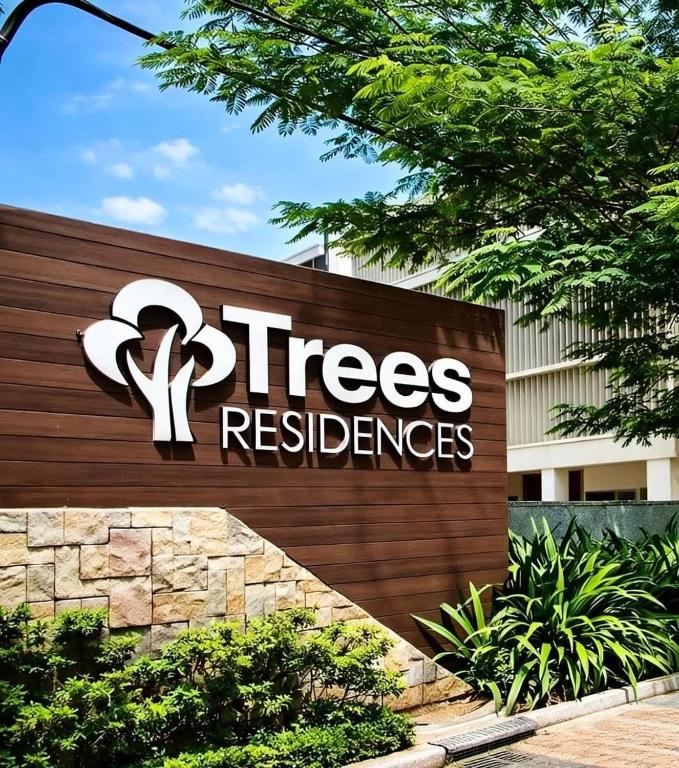 a sign for a treesres reserves sign in front of a building at R&N Trees Residence in Manila