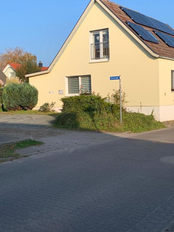 a house with solar panels on the roof at Ferienhaus Boddensicht in Breege