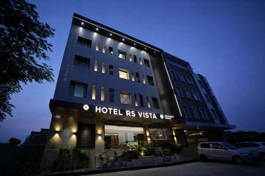 a hotel building with lights on top of it at Hotel Rs Vista - Agra in Agra