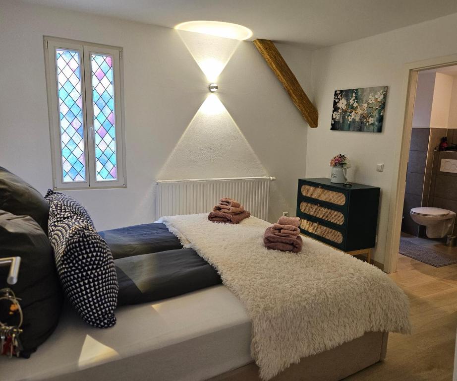 a bedroom with a bed with a rug on it at Friends & Family Olymp in Bamberg