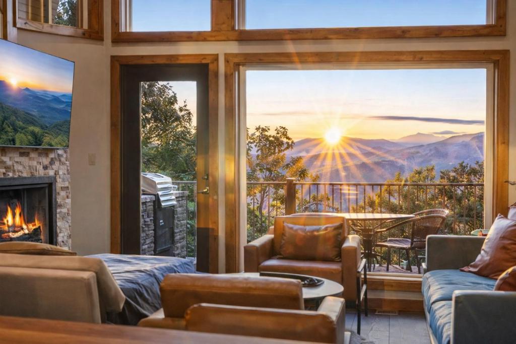 a living room with a fireplace and a view of the mountains at Gatlinburg Amazing Views-EV Chrger - Firepit, Spa Shower and Jacuzzi,Hot Tub in Gatlinburg