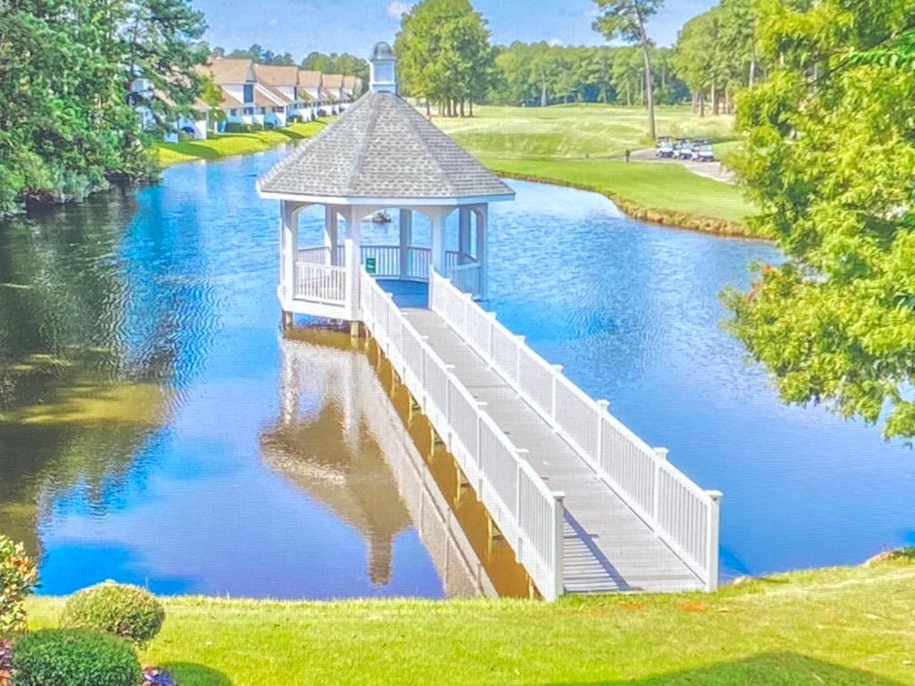 a gazebo on top of a river at First Class Treatment Luxurious end unit Patio Pool Restaurant Bar on premises Steps away from Everything else! Spacious Condo Stocked with all You Need! in Myrtle Beach