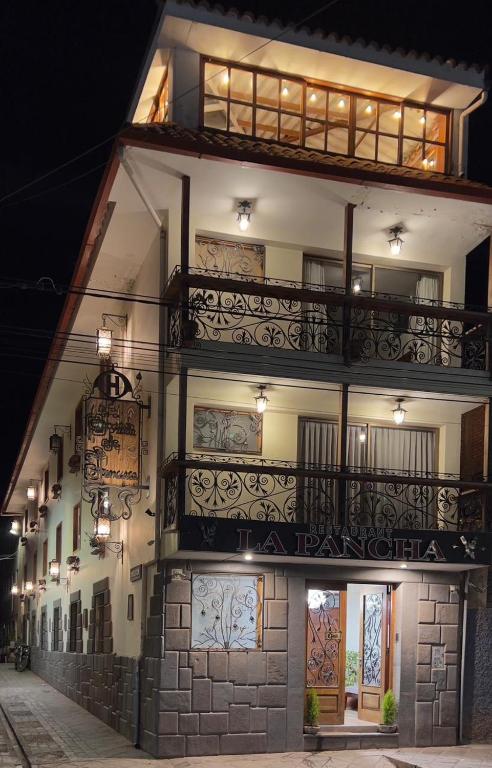 a building with balconies on the side of it at La Posada de Francisca in Pisac