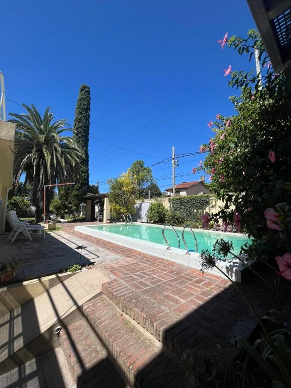 a swimming pool in the middle of a yard at Carpe Diem Gonnet in Joaquín Gorina