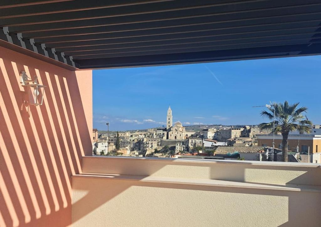 a balcony with a view of a city at Antica Dimora Petito Luxury in Matera