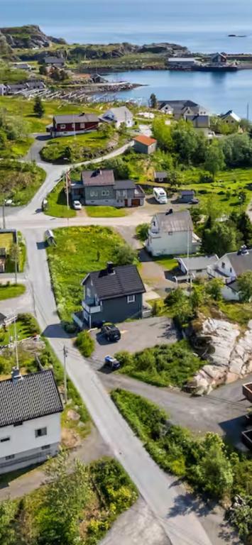 an aerial view of a small town with a road at Sivi`s hus in Moskenes