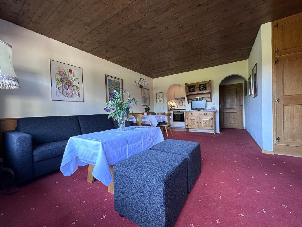 a living room with a table and a couch at Chalet Cristall Superior Appartement 10 in Leutasch