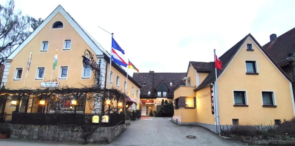 a building with flags on the side of it at Hotel Smart-Inn in Erlangen