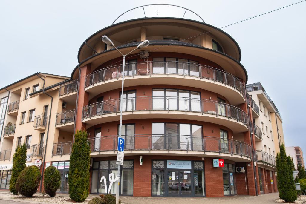 a large building with a round top at Rotunda 309 in Dunajská Streda