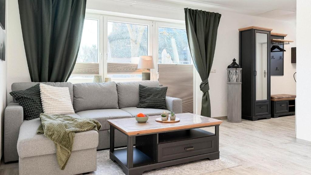 a living room with a couch and a coffee table at Dat Lütte Glück in Pruchten