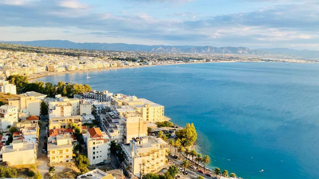 an aerial view of a city next to the water at SMART Apartments LOUTRAKI in Loutraki