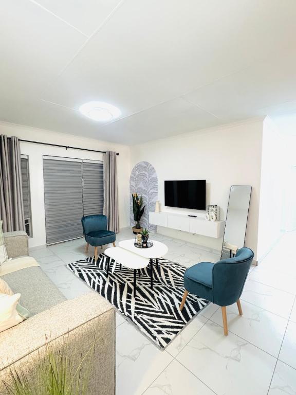 a living room with a zebra rug at Brytelight Luxe 1 Bedroom in Rustenburg
