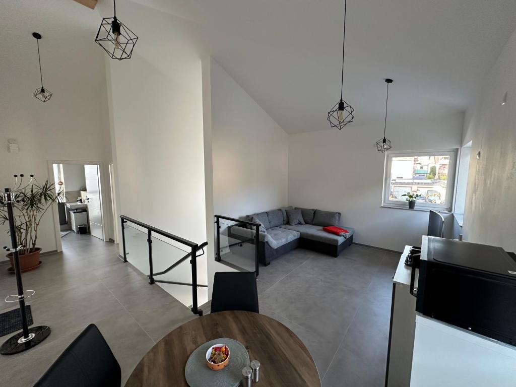 a living room with a couch and a table at Thiels Mansion in Sankt Sebastian