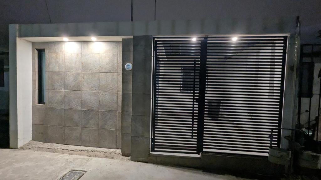 a building with a door with lights on it at Acogedora Casa in El Sauzal