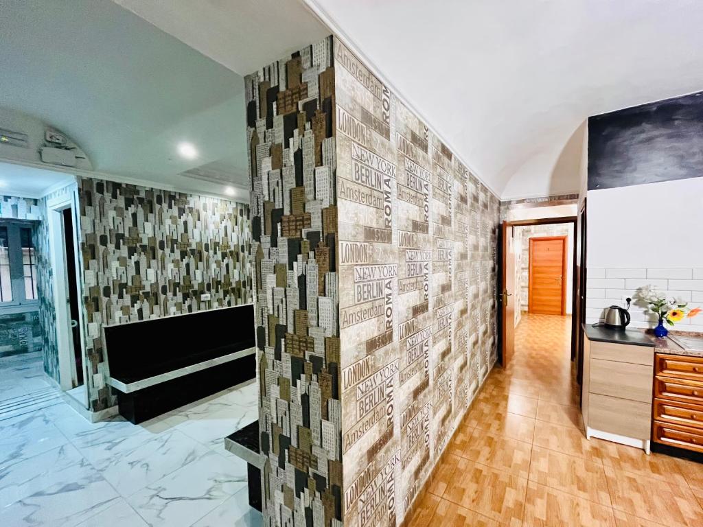 a room with a wall covered in tiles at Beauty Holidays in Rome
