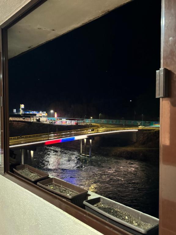 a view from a window of a river at night at Apartman 7 Foča in Foča