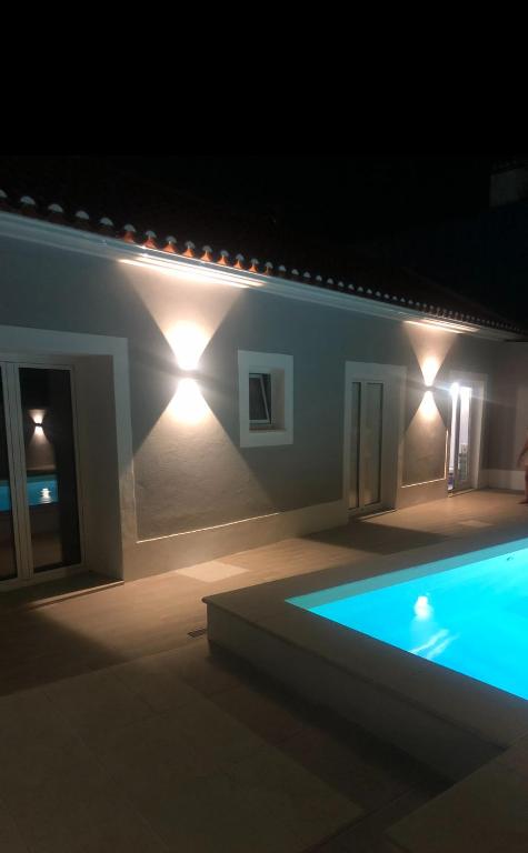 a house with a swimming pool at night at Casas Morgado in Valada