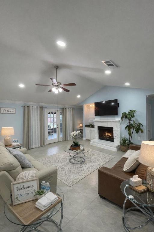 a living room with a couch and a fireplace at Stunning Home in Plano! in Plano