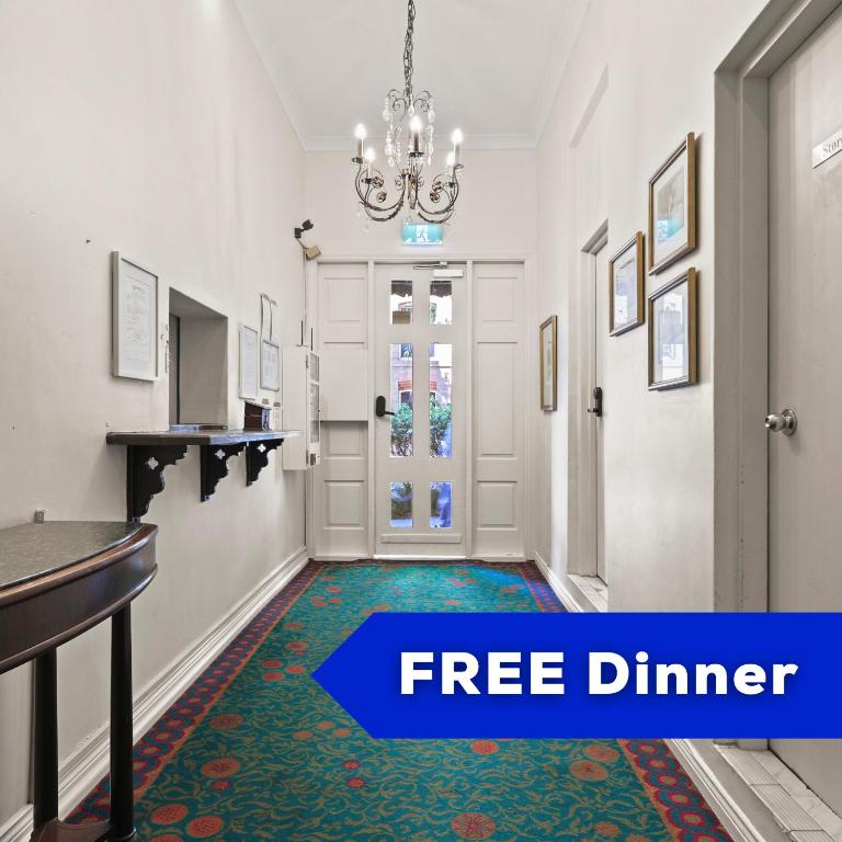 a hallway with the words free dinner and a picture of a room with a door at Darling Harbour Hostel - Near ICC in Sydney