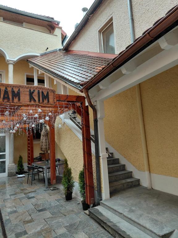 a house with a pergola and a table and stairs at Rohrbacher Hof in Berg bei Rohrbach