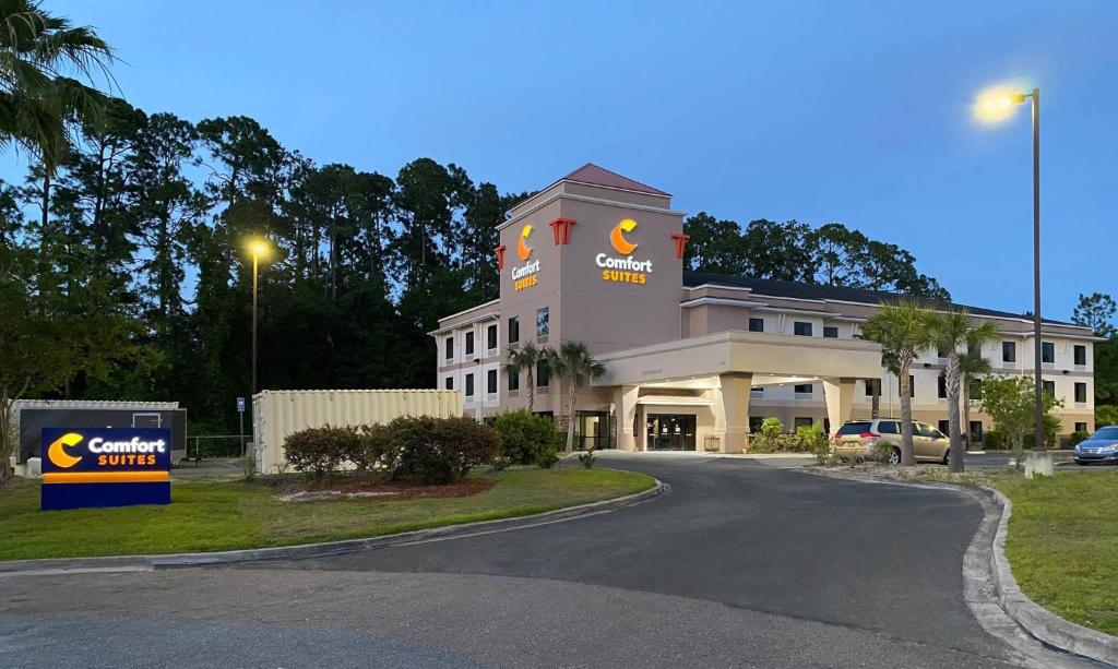 a building with a sign on the side of a road at Comfort Suites Kings Bay Naval Base Area in Kingsland