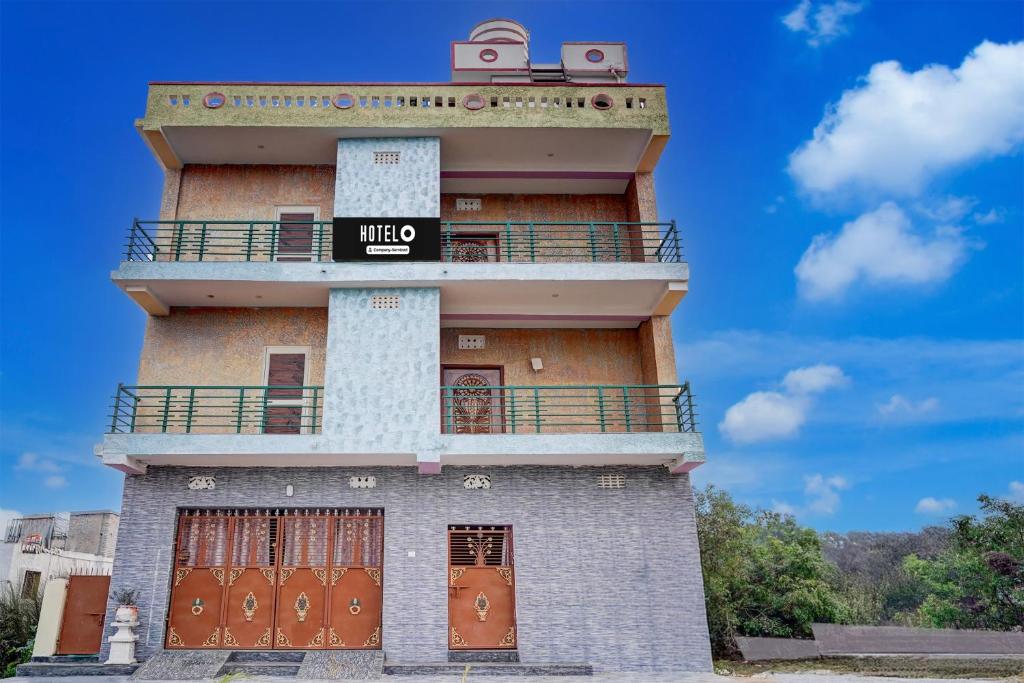 a building with a sign that reads mineo at Hotel O Puri Seaview Formerly Sea Star in Puri