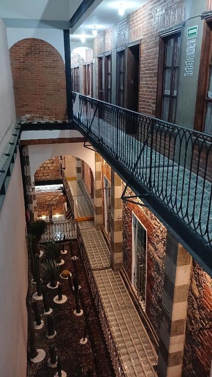 an overhead view of a staircase in a building at Hostal KEMMM in Mexico City