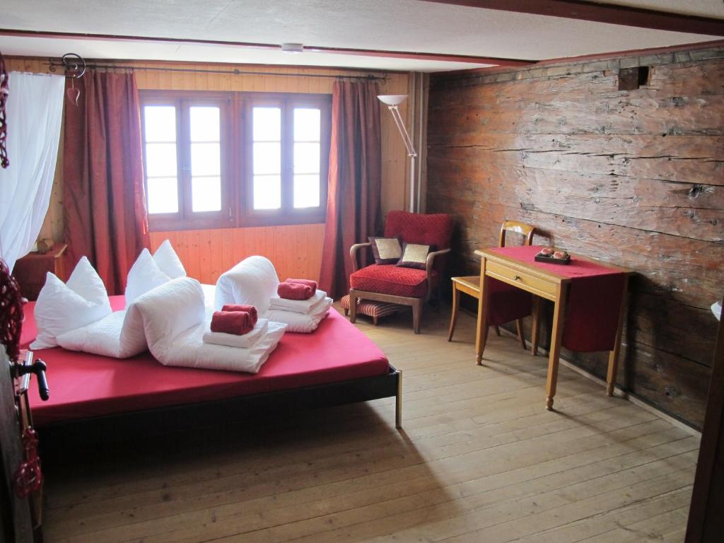 Postel nebo postele na pokoji v ubytování Hostel Rotschuo Jugend- und Familienferien
