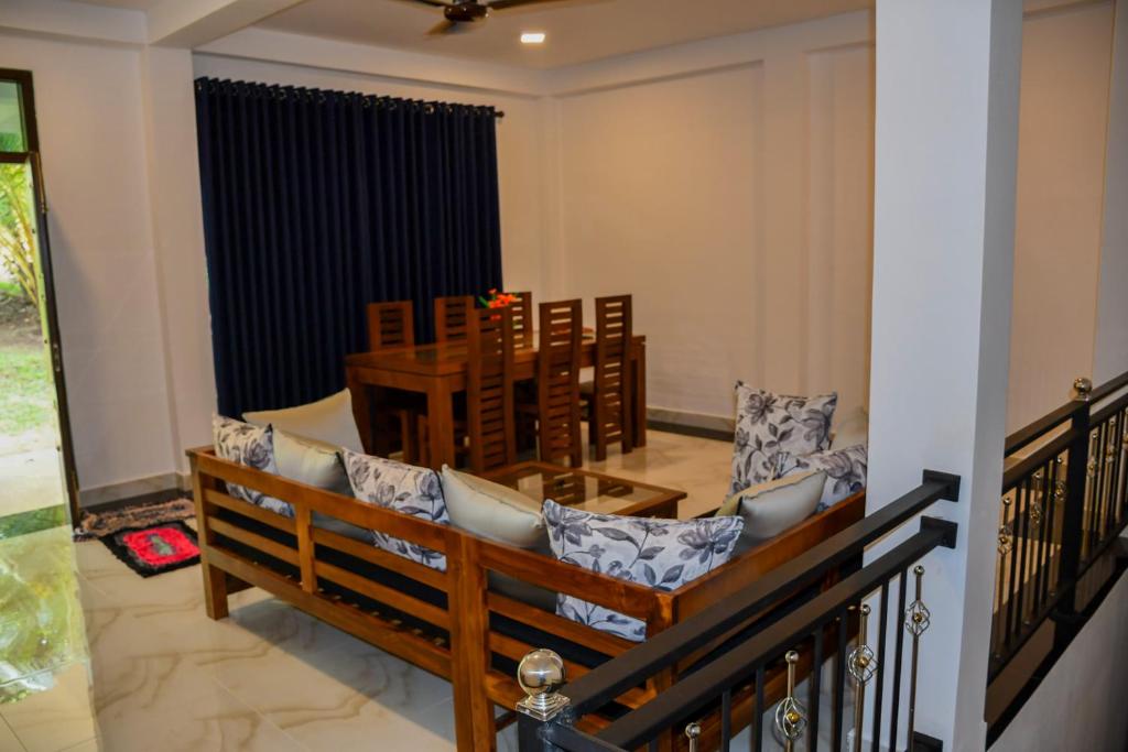 a dining room with a table and chairs at Vishu villa in Galle