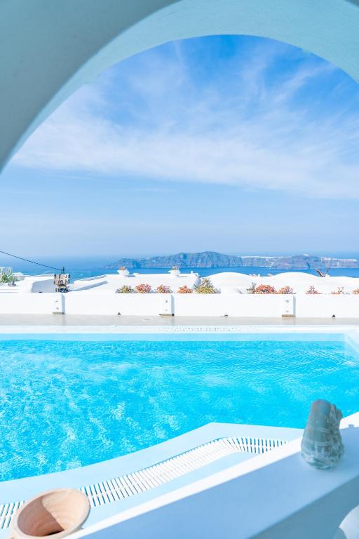 a swimming pool with a view of the ocean at Salvatore Caldera Suites in Imerovigli