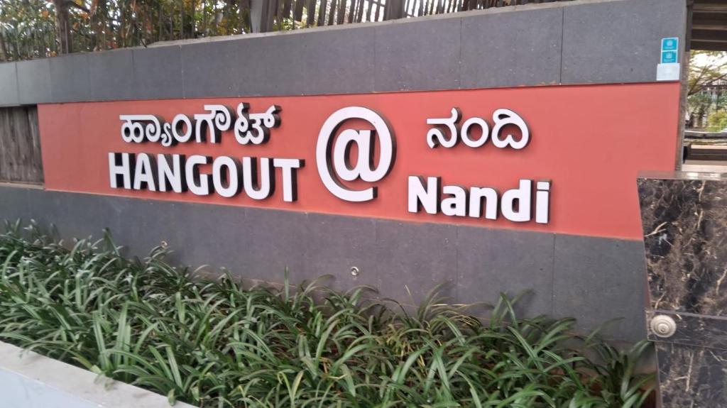 a sign for a hanoi harbour nanthi at Hangout at Nandi Hills in Nandigunda