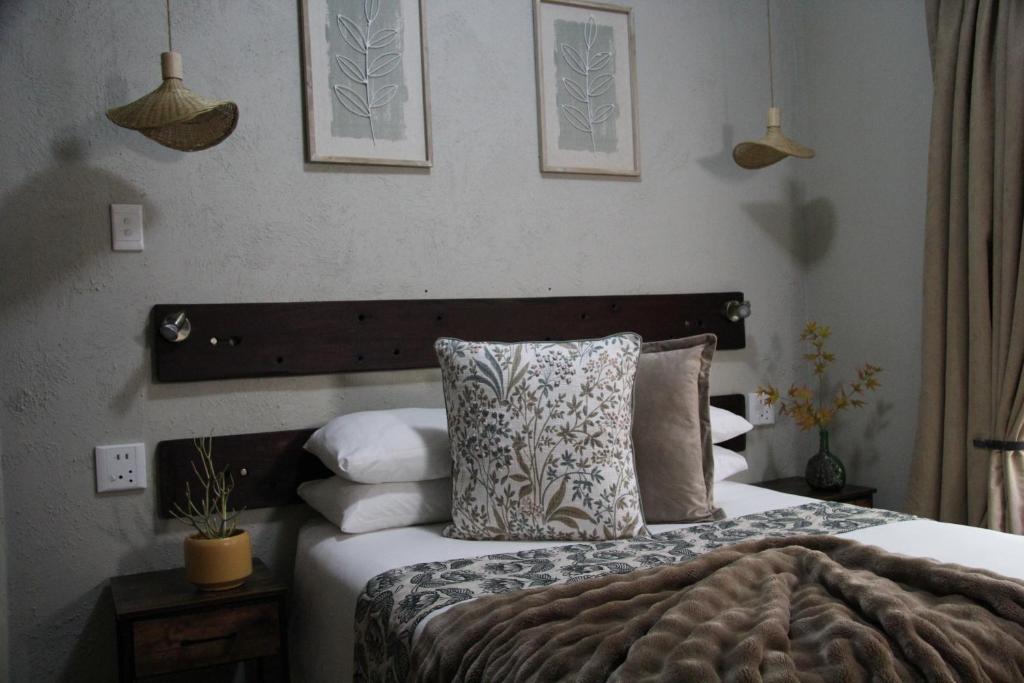a bedroom with a bed with pillows on it at AshTree GuestHouse in Hanover