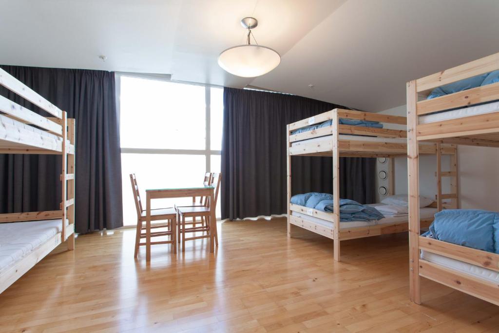 Postel nebo postele na pokoji v ubytování Pronova Hotell & Vandrarhem