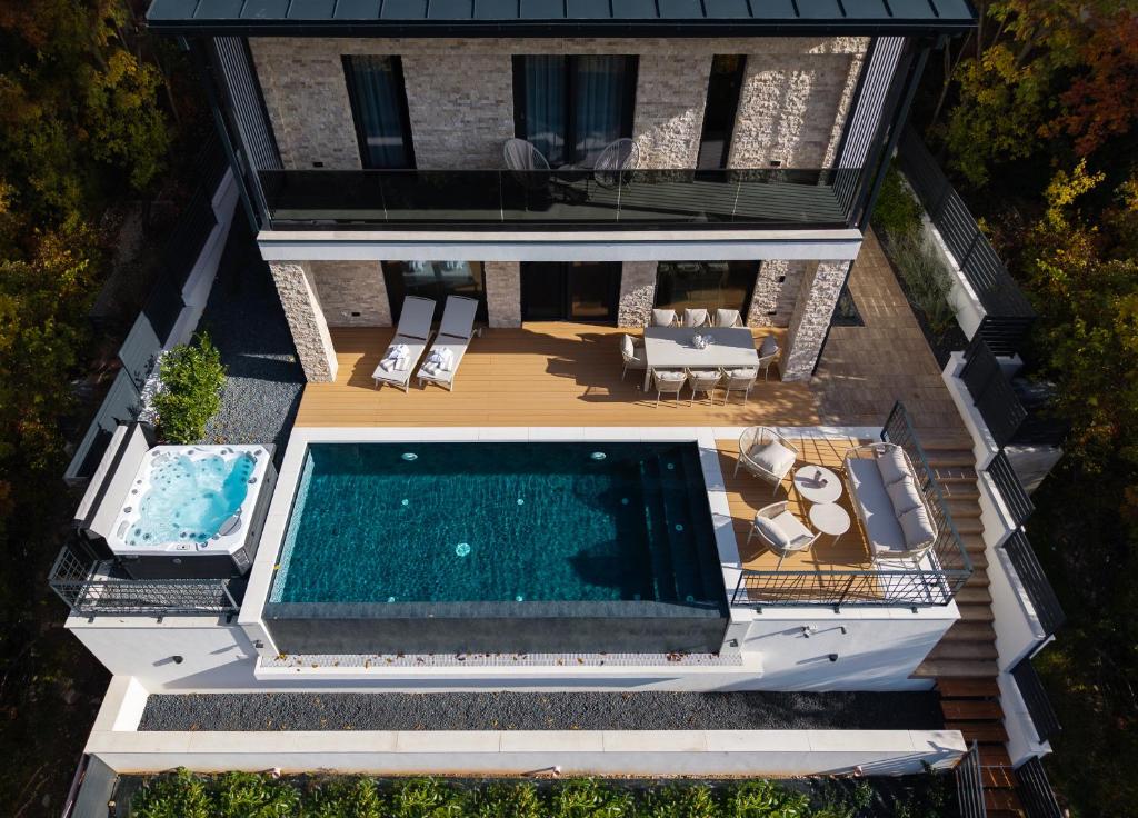 an aerial view of a house with a swimming pool at Villa Slowave in Balatonalmádi