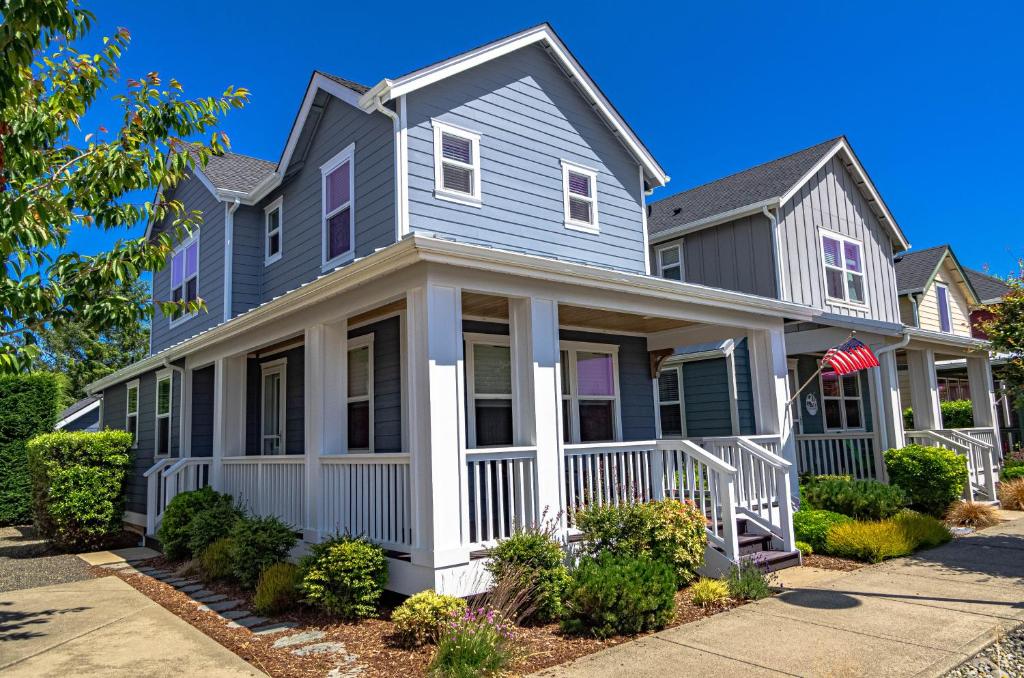a gray house with an american flag at Hydrangea Hideaway in Ocean Shores