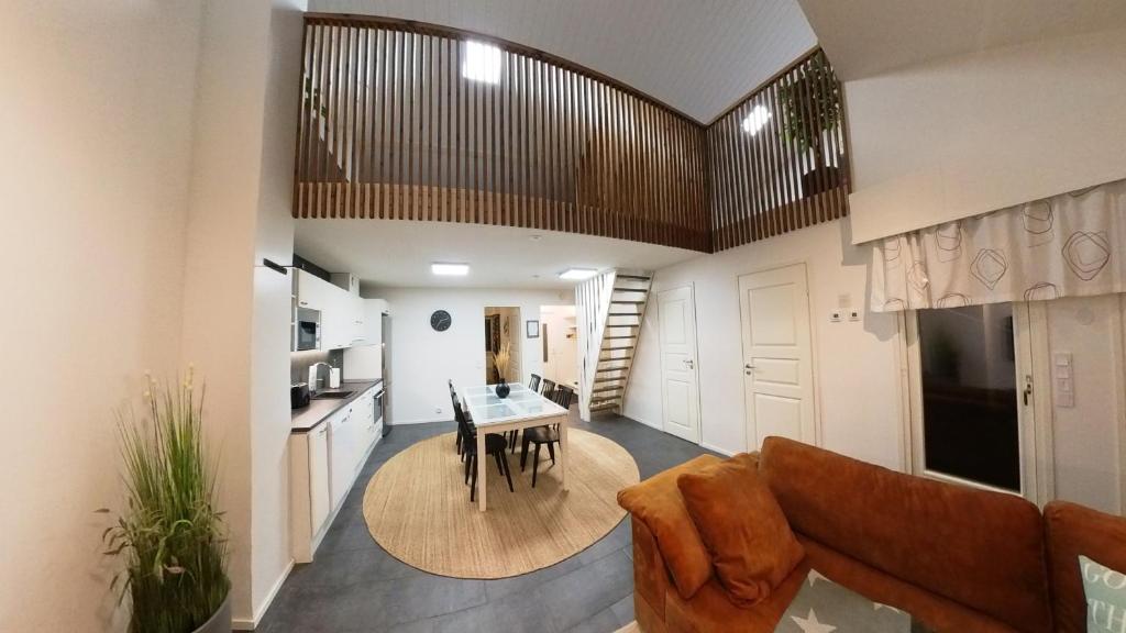a living room with a couch and a table at Keskuskarintie 9 A3 in Kalajoki