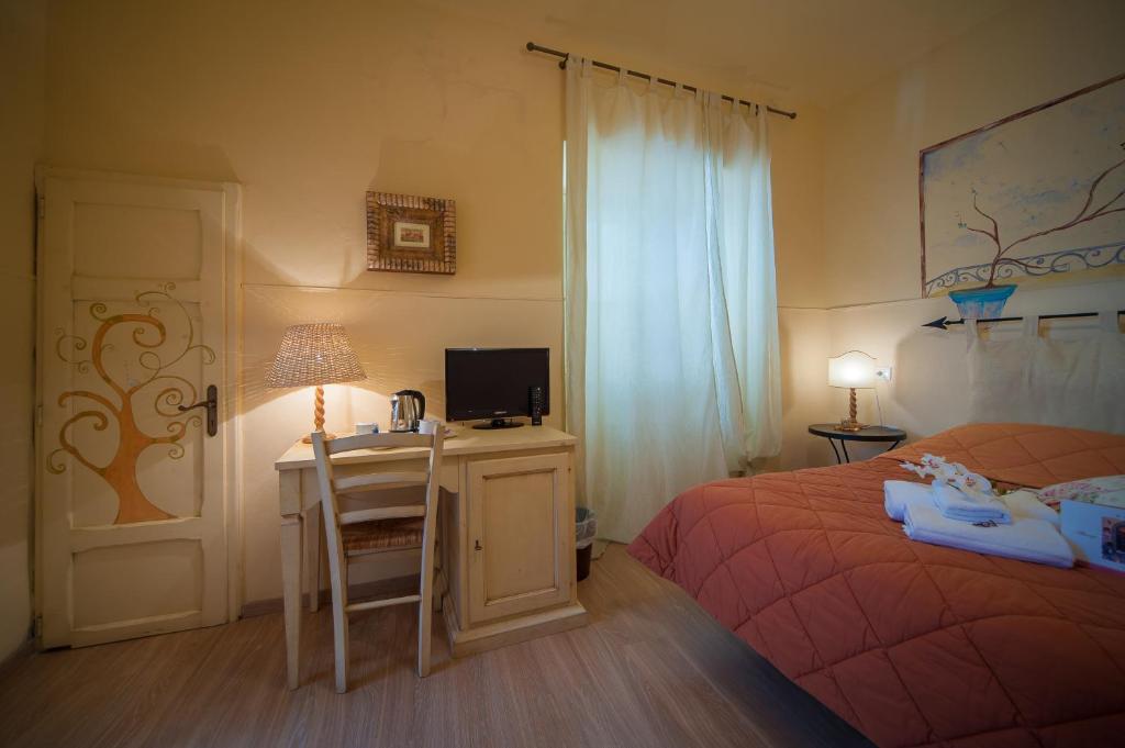 Postel nebo postele na pokoji v ubytování Albergo Etruria