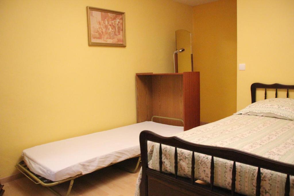 Postel nebo postele na pokoji v ubytování Le Moulin