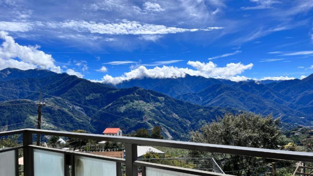 a view of mountains from the balcony of a house at Water Swing B&B in Ren'ai