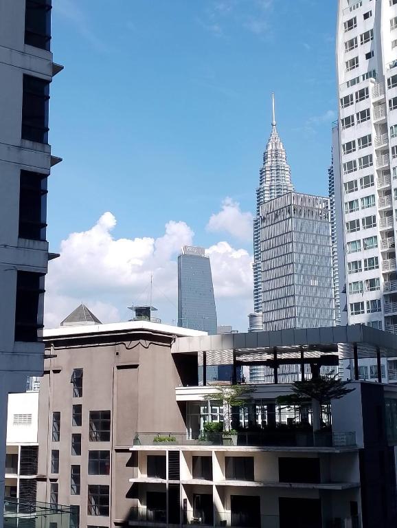 a building in a city with tall buildings at Studio Apartment KLCC Area in Kuala Lumpur